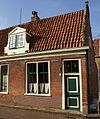 Eenvoudige laat 18e-eeuwse woning onder dwarsdak