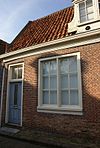 Eenvoudige laat 18e-eeuwse woning onder dwarsdak