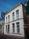 Pand, aanvankelijk bestaande uit twee huizen met aan de achterzijde twee houten puntgevels
