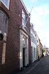 Remonstrantse hofje.JPG -  Remonstrantse Hofje. Built in 1774 with the means from the testament of Isabelle van Leeuwaerden. Built by Nicolaes Tijsterman on the site of a 15th century nunnery dedicated to St. Ursula. Some of the original foundations of the nunnery are visible.