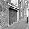 Exterieur PAKHUIS, VOORGEVEL, TOEGANGSDEUREN MET VERHOOGDE STRAAT - Haarlem - 20287918 - RCE -  Exterieur PAKHUIS, VOORGEVEL, TOEGANGSDEUREN MET VERHOOGDE STRAAT 