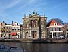 Teylersmuseum.JPG -  Main entrance of Teyler's Museum in Haarlem. The museum is housed in the former home of Pieter Teyler, whose estate went towards perpetuating the study of art and science. While living he installed the 'Oval Room' for this purpose. Since then (1778), the museum has been expanded, and this imposing entrance was designed in 1878 to make more of an impression than the old Damstraat entrance, which is still the entrance to his old house. That older entrance is only used today for special tours of …