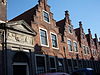 St.Elisabeth Gasthuis Haarlem.JPG -  Foto of St, Elisabeth Gasthuys gate and houses. The keystone is dated 1612, but the doorway was the main entrance from 1581 up to the 20th century. 
