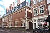 Lieve de Key wing of Haarlem City Hall.JPG -  Lieve de Key wing of Haarlem City Hall. The arched gateway in the middle leads to 't Pand, an alley that now turns sharply to the right as a path to the Gymnasium. It used to run straight to the back cloisters of the city hall, but this has since been closed off with a door. The blind wall on the first floor of the City Hall is the 