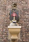 Gevelsteen Haarlem stadhuis - wapen met dorre boom -  Gable stone inside the Pandpoort of the Haarlem City Hall. This was one of four lions holding the city shield hanging in a 