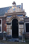 Frans-loenen-hofje-gate-1625.JPG - Gate of Frans Loenen Hofje in Haarlem on the Witte Heren straat. Hofje dates from 1625 and was founded in memory of silk merchant Frans Loenen.