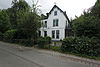 Dubbele villa met bijbehorende erfscheiding, in schilderachtige eclectische trant