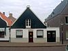 Rijksmonument-38924-20111103095748 -  Pand met geverfde pui Hippolytushoef