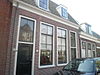 Italiaanse Zeedijk 24 -  Dubbel dwarshuis onder pannen zadeldak. 