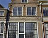 Deel van de voorgevel met versierd fries boven de pui - Hoorn - 20277567 - RCE -  Bossuhuizen: Deel van de voorgevel met versierd fries boven de pui 