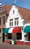 Huis met gepleisterde topgevel