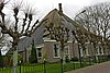 Stolphoeve met ronde schoorsteen, spiegel en dakkapel