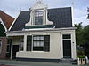 Zuiderhoofdstraat 115 Krommenie Rijksmonument 39965 -  voorgevel woonhuis in Zaanse stijl 