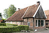 Boerderij met uitbouw in vakwerk ter weerszijden van de niendeur linkeraanzicht; Koppelsbrink 32, Borne