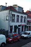 Pand, waarin wellicht een deel van de laat-middeleeuwse stadsmuur is bewaard gebleven