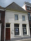 Pand met gepleisterde gevel