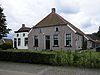 Boerderij onder met pannen gedekt wolfdak