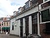 Hoek Groenmarkt. Gepleisterd laag woonhuis