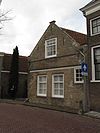 Pand met zadeldak en puntgevel met vlechtingen