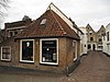 Hoekpandje onder schilddak