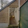 Interieur muurkas tegen tuinmanswoning