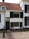 Pand van monumentale waarde, onderdeel vormend van een waardevolle vechtwand