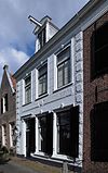 Pand met gepleisterde gevel
