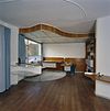 Interieur, overzicht werkruimte in de woonkamer met verlaagd plafond en vast bureau, aflegblad en tekeningenkast - Utrecht - 20340457 - RCE -  Woonhuis Architect Sybold Van Ravesteyn: Interieur, overzicht werkruimte in de woonkamer met verlaagd plafond en vast bureau, aflegblad en tekeningenkast 