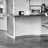 Interieur, muur onder de vaste wandtafel tussen de woonkamer en de werkkamer met metalen plinten - Utrecht - 20340425 - RCE -  Woonhuis Architect Sybold Van Ravesteyn: Interieur, muur onder de vaste wandtafel tussen de woonkamer en de werkkamer met metalen plinten 