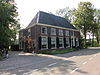 Dubbel woonhuis, bakstenen gebouw onder pannen schilddak