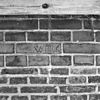 Exterieur EERSTE VERDIEPING, WESTGEVEL, INGEKRASTE NAAM, TUSSEN GOOT EN KOZIJNEN (GEBOUW CC) - Woerden - 20283125 - RCE -  Kasteel Woerden: Exterieur EERSTE VERDIEPING, WESTGEVEL, INGEKRASTE NAAM, TUSSEN GOOT EN KOZIJNEN (GEBOUW CC) 
