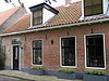 Dwarshuis eindigend met tuitgevel