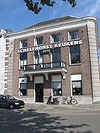 Fors herenhuis op hoek loskade en nieuwe Poortstraat