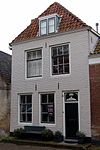 Huis met geverfde langsgevel