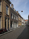 Middelburg Herenstraat1618 -  Middelburg, Herenstraat 16, 18, and 14 (center, brickstone). #16 is the right part of the building; ##16 and 18 are in the left part.