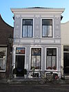 Huis met lijstgevel, pleisterwerk