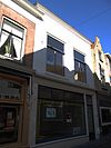 Huis met gepleisterde lijstgevel