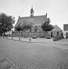 Overzicht zuidzijde, met dakruiter op de nok - Vrouwenpolder - 20352653 - RCE -  Nederlands Hervormde Kerk: Overzicht zuidzijde, met dakruiter op de nok (opmerking: Gefotografeerd voor Monumenten In Nederland Zeeland) 