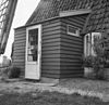 Detail, vernieuwd houten portaal aan de buitenzijde van de molen - Alblasserdam - 20005500 - RCE -  De Blokker: Detail, vernieuwd houten portaal aan de buitenzijde van de molen 