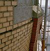 Detail torenopbouw in gele verblendsteen met liseen in rode verblendsteen op natuurstenen console - Boskoop - 20330063 - RCE -  Watertoren: Detail torenopbouw in gele verblendsteen met liseen in rode verblendsteen op natuurstenen console 