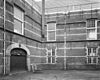 Gedeelte gevel binnenplaats - Delft - 20049164 - RCE -  Arsenaal = Armamentarium: gedeelte gevel binnenplaats 