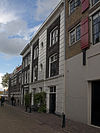 Dordrecht Hoge Nieuwstraat8+12 -  Dordrecht, Hoge Nieuwstraat 8+12 (center, the facade with the white vertical stripe, #8 is left of the stripe, #12 is right of the stripe) 