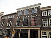 Achterhuis met afgeknotte puntgevel en afgewolfd zadeldak en schilddak