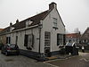 Dwarshuis van alleen begane-grond met zadeldak tussen puntgevels