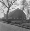 Houten zomerhuis met pannen zadeldak