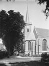Zicht op de kerktoren en gedeelte zuidwestgevel - Katwijk aan den Rijn - 20124143 - RCE -  Nederlands Hervormde Kerk: Zicht op de kerktoren en gedeelte zuidwestgevel 