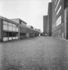 Overzicht magazijn en werkplaatsen 1978 en zicht op riffellokaal uit 1937 en molengebouw 1947