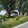 Overzicht voorgevel en linker zijgevel - Maasland - 20341609 - RCE -  Boerderijen/ Krukhuis: Overzicht voorgevel en linker zijgevel (opmerking: voor restauratie) 