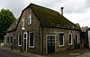 Boerderij onder rieten wolfdak